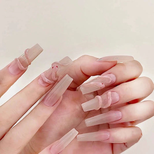 Serpent’s Whisper avant-garde press-on nails feature a bold, sculptural design that merges elegance with a surreal edge
