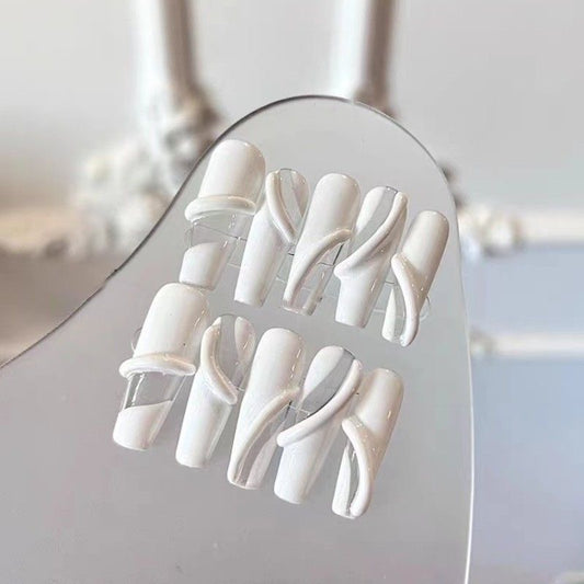 Porcelain Swirl Elegance set of 10 press-on nails showcasing a sophisticated blend of matte white and clear acrylic, designed in a modern square-oval shape