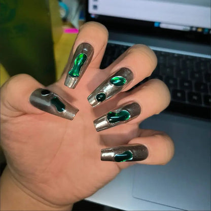 Chrome Emerald Flow 10 stiletto-shaped press-on nails featuring a bold industrial-chic aesthetic.