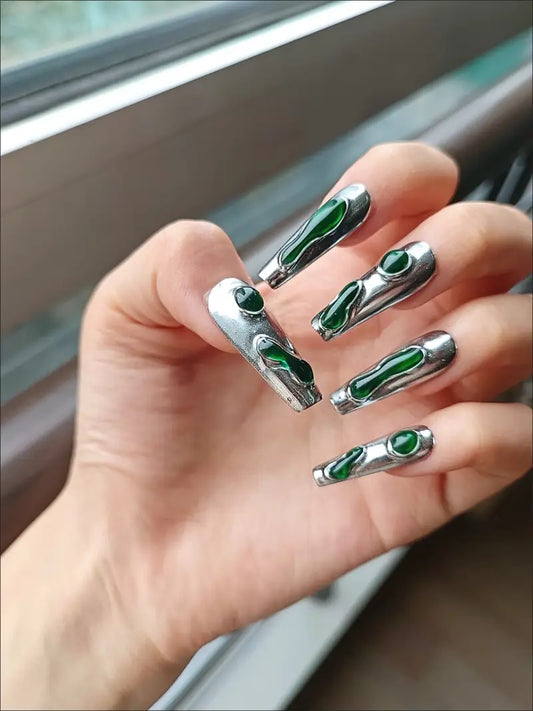 Chrome Emerald Flow 10 stiletto-shaped press-on nails featuring a bold industrial-chic aesthetic.