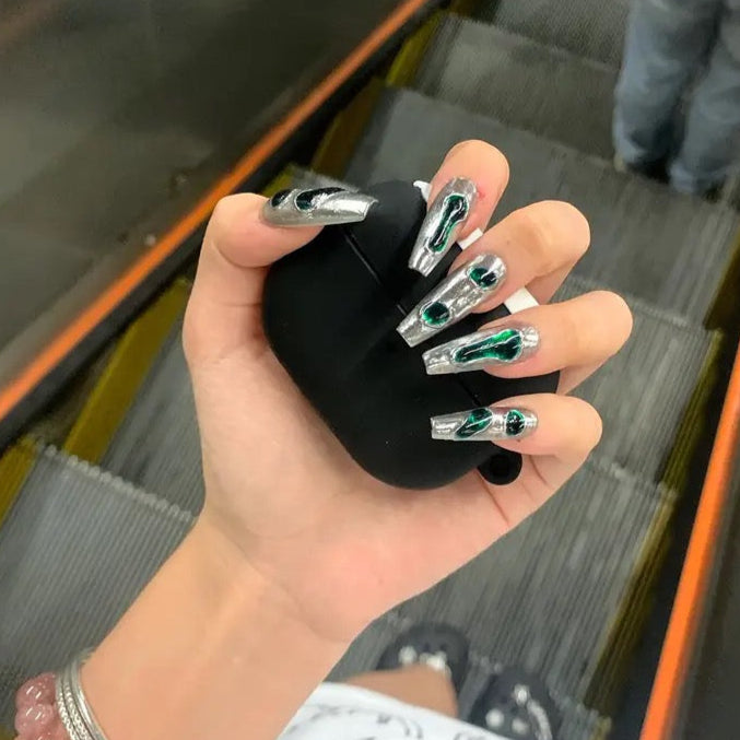 Chrome Emerald Flow 10 stiletto-shaped press-on nails featuring a bold industrial-chic aesthetic.