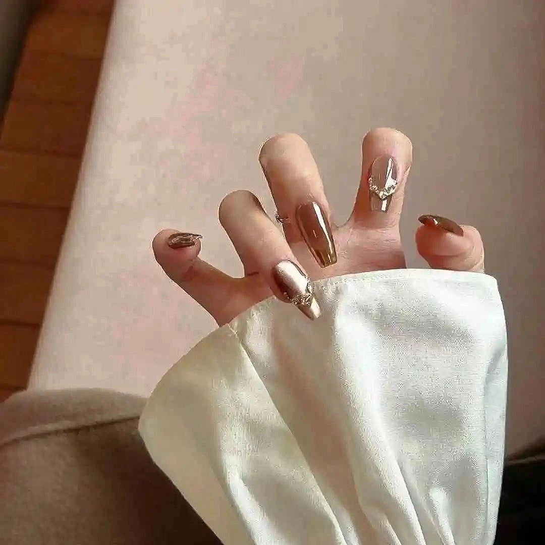 Mocha Gold Foil Tips set of almond-shaped press-on nails featuring a warm taupe-brown base with a smooth, creamy finish
