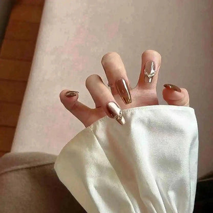Mocha Gold Foil Tips set of almond-shaped press-on nails featuring a warm taupe-brown base with a smooth, creamy finish